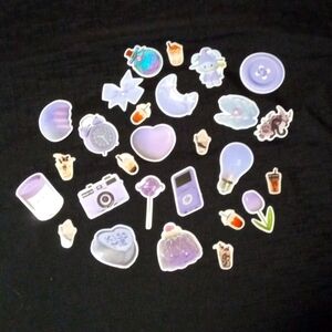 There are 27 stickers in the pack. The color theme is purple.